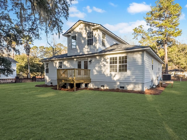 rear view of house featuring a wooden deck, a yard, and central AC unit