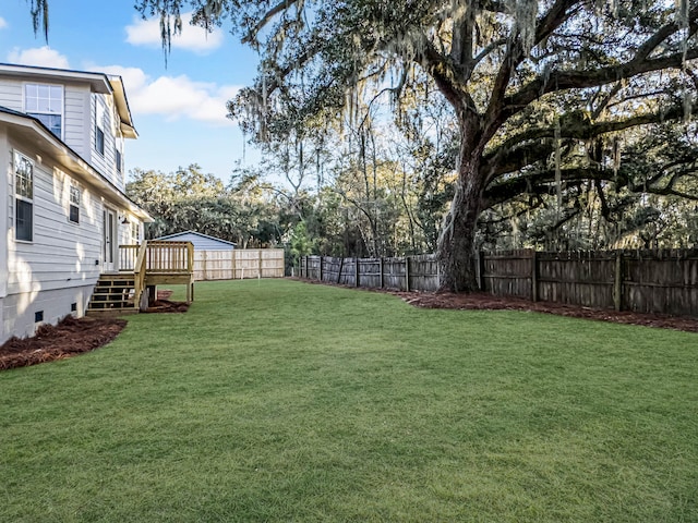 view of yard featuring a deck