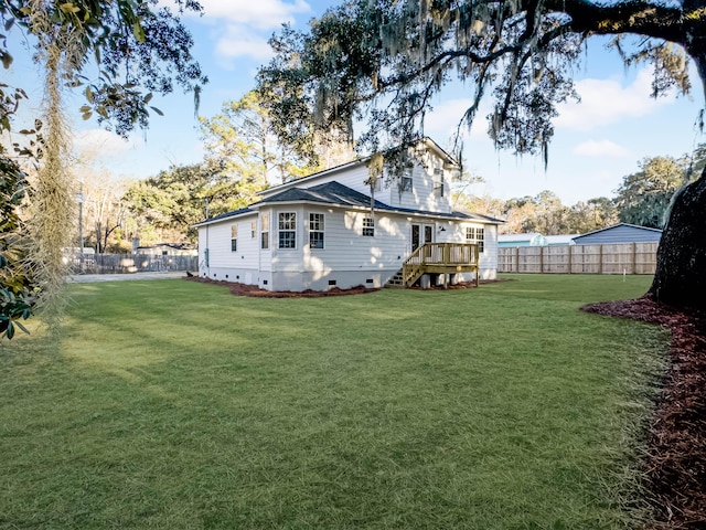 rear view of property with a lawn