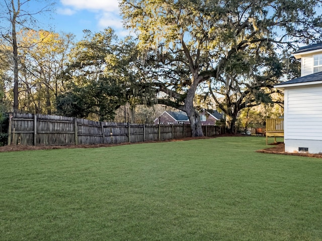 view of yard with a wooden deck