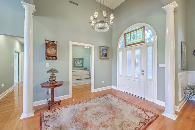109 Waveney Cir, Goose Creek, SC 29445 - entryway featuring decorative columns, wood finished floors, and a towering ceiling