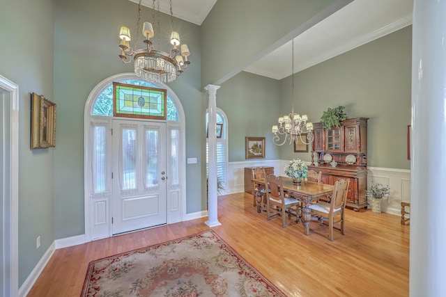 109 Waveney Cir, Goose Creek, SC 29445 - foyer featuring a chandelier, a towering ceiling, wood finished floors, ornamental molding, and a wainscoted wall