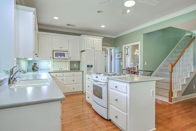 109 Waveney Cir, Goose Creek, SC 29445 - kitchen featuring white appliances, a kitchen island, light wood-style flooring, white cabinetry, and ceiling fan