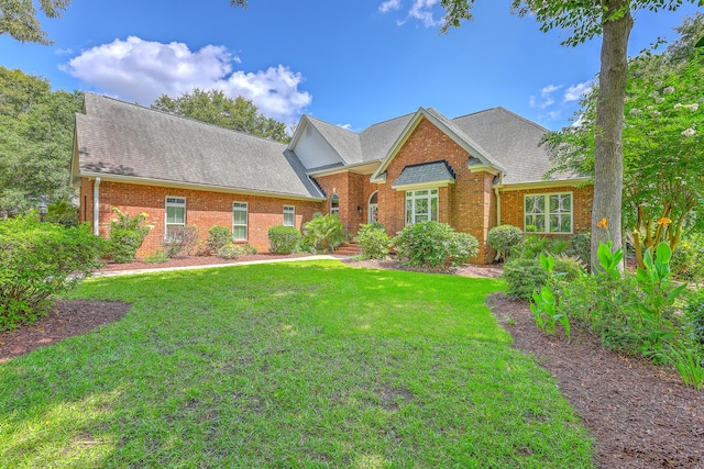 109 Waveney Cir, Goose Creek, SC 29445 - view of front of home with brick siding, a front lawn, and a shingled roof
