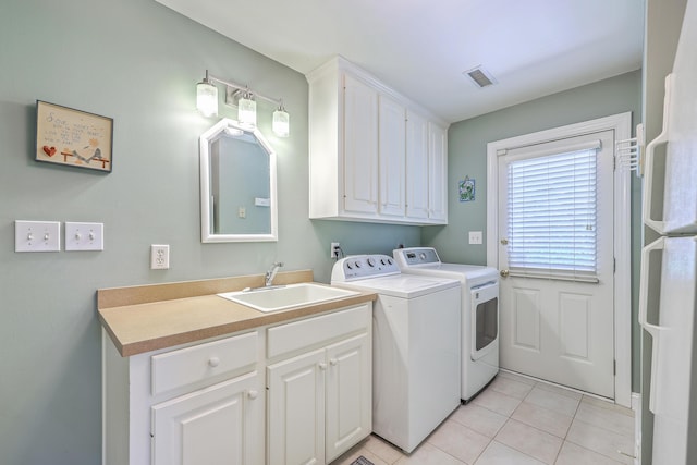 109 Waveney Cir, Goose Creek, SC 29445 - laundry area featuring washer and dryer, cabinet space, and light tile patterned flooring