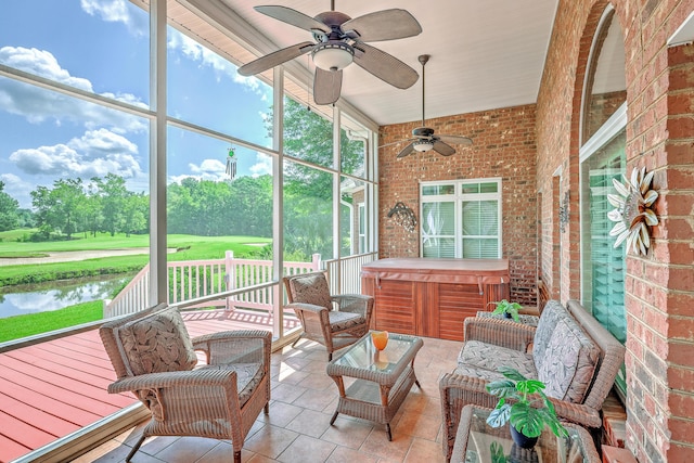 109 Waveney Cir, Goose Creek, SC 29445 - sunroom / solarium featuring a jacuzzi, ceiling fan, a water view, and view of golf course