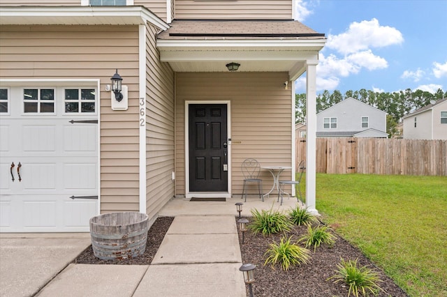 property entrance with a lawn and covered porch