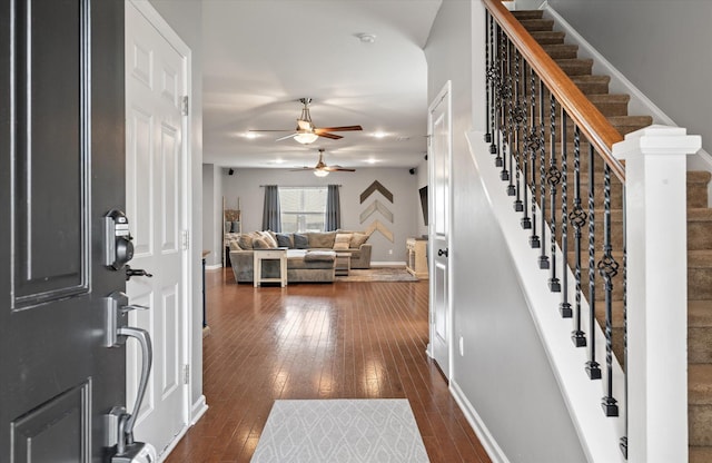 foyer entrance with dark wood-type flooring