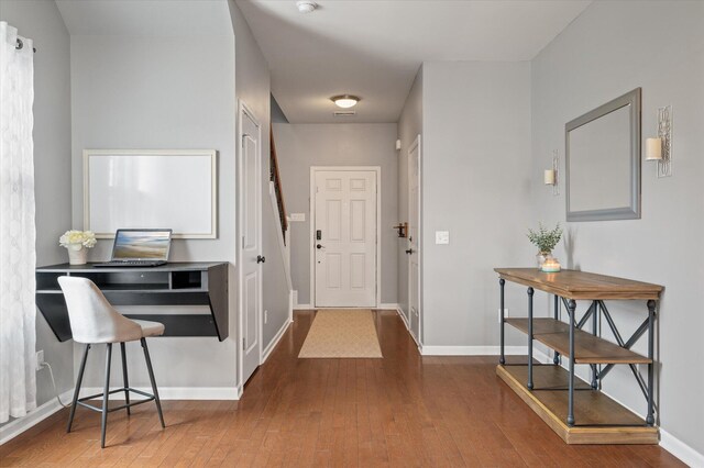 foyer entrance with hardwood / wood-style floors