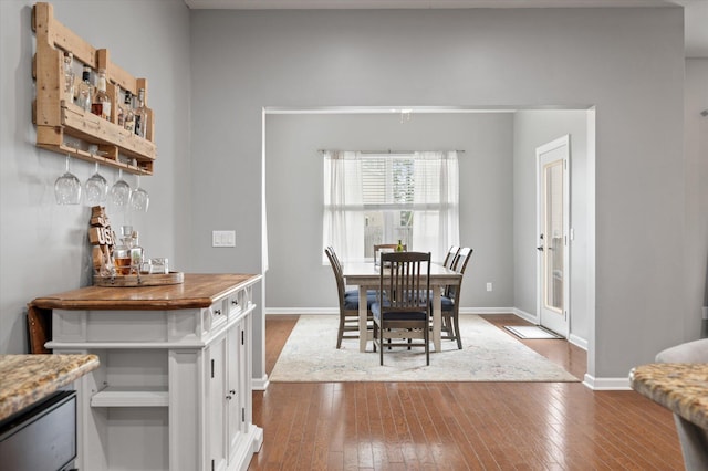 dining area featuring hardwood / wood-style floors