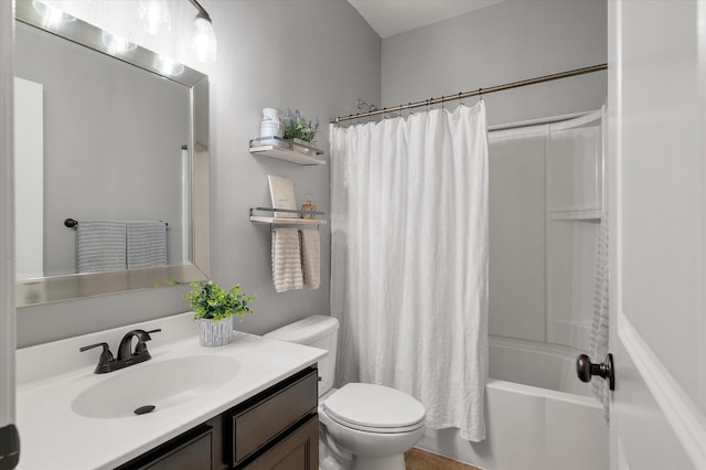 full bathroom with vanity, toilet, and shower / tub combo