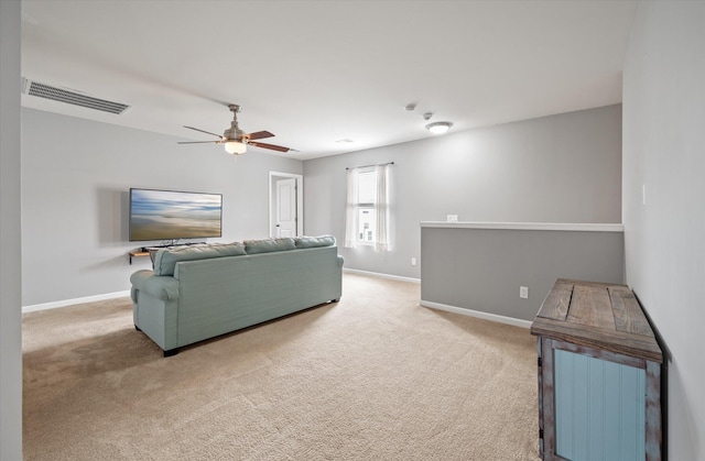 carpeted living room featuring ceiling fan