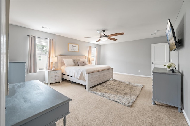 bedroom featuring ceiling fan and light colored carpet