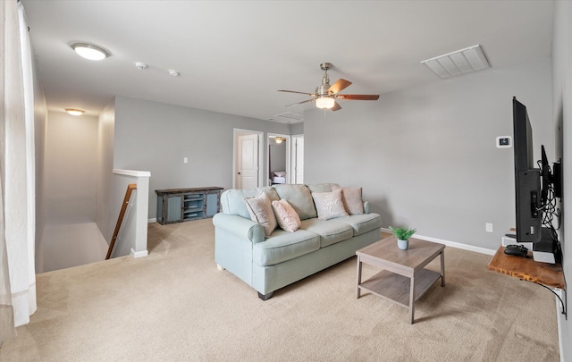 living room with light colored carpet and ceiling fan