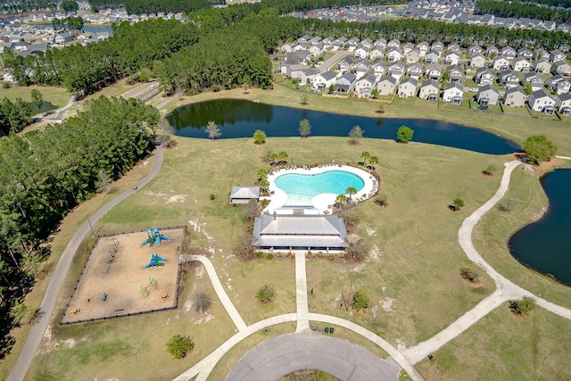 birds eye view of property with a water view