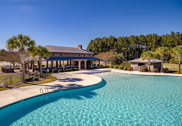 view of swimming pool featuring a patio