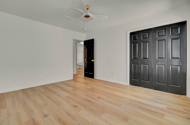 unfurnished bedroom featuring light wood-type flooring, ceiling fan, and a closet