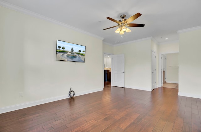 spare room with ceiling fan, dark wood-type flooring, and crown molding