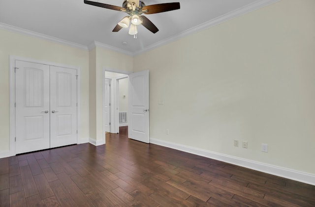 unfurnished bedroom with a closet, ceiling fan, crown molding, and dark hardwood / wood-style floors