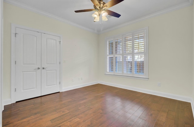 unfurnished bedroom with ceiling fan, dark hardwood / wood-style flooring, and ornamental molding