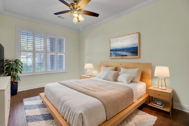 bedroom with ornamental molding, ceiling fan, and dark hardwood / wood-style floors