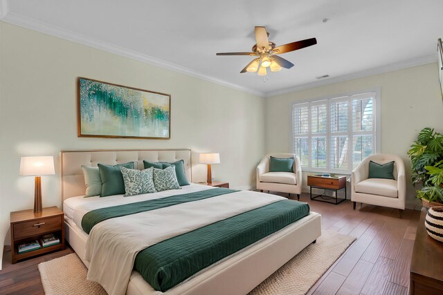 bedroom with ceiling fan, dark wood-type flooring, and crown molding