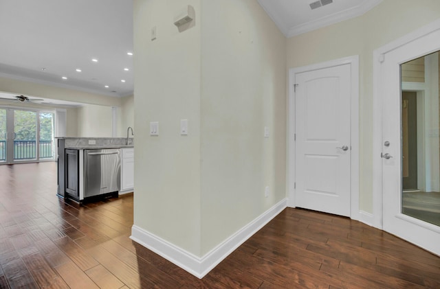 hall featuring dark hardwood / wood-style flooring and crown molding