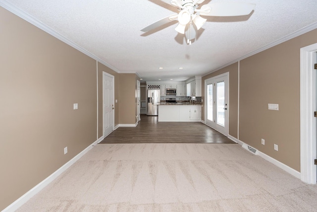 102 Six Point Ct, Goose Creek, SC 29445 - unfurnished living room with carpet floors, ornamental molding, a ceiling fan, baseboards, and recessed lighting
