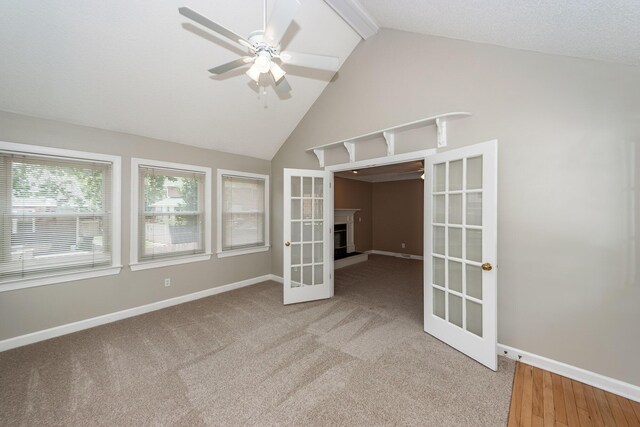 102 Six Point Ct, Goose Creek, SC 29445 - carpeted empty room with ceiling fan, baseboards, beam ceiling, high vaulted ceiling, and a fireplace with raised hearth