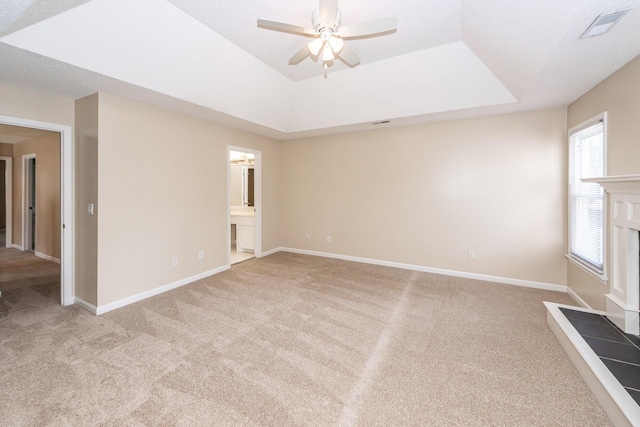 102 Six Point Ct, Goose Creek, SC 29445 - unfurnished living room featuring carpet flooring, a ceiling fan, a tray ceiling, and baseboards
