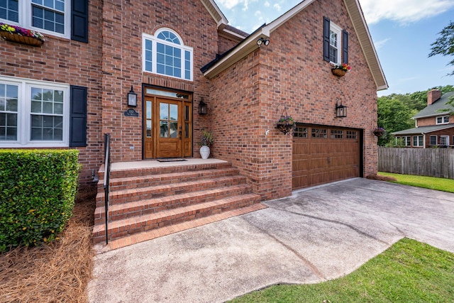 102 Six Point Ct, Goose Creek, SC 29445 - property entrance with brick siding, concrete driveway, and an attached garage