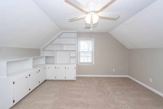 102 Six Point Ct, Goose Creek, SC 29445 - additional living space featuring lofted ceiling, light colored carpet, a textured ceiling, ceiling fan, and baseboards