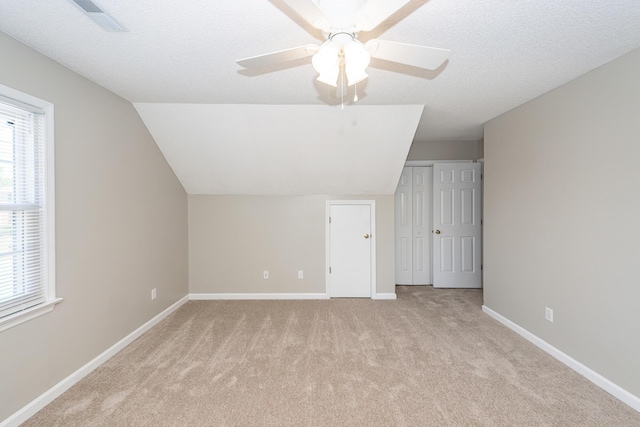 102 Six Point Ct, Goose Creek, SC 29445 - additional living space with light carpet, vaulted ceiling, baseboards, and a ceiling fan