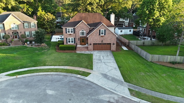 102 Six Point Ct, Goose Creek, SC 29445 - view of front of home with brick siding, a garage, driveway, a chimney, and a shingled roof