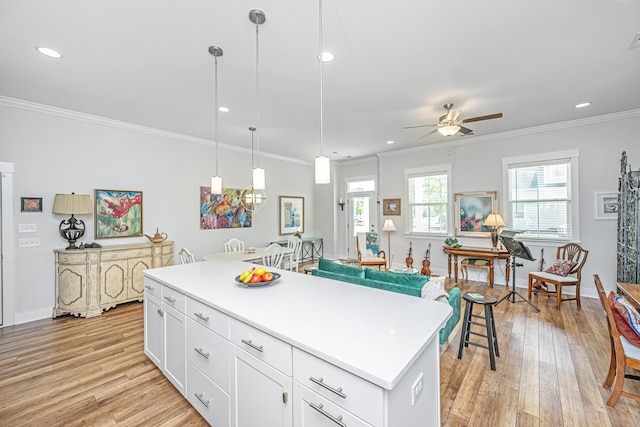 1515 Pogonia St Unit 2, Mount Pleasant, SC 29466 - kitchen with light wood-style flooring, ceiling fan, recessed lighting, white cabinets, and pendant lighting