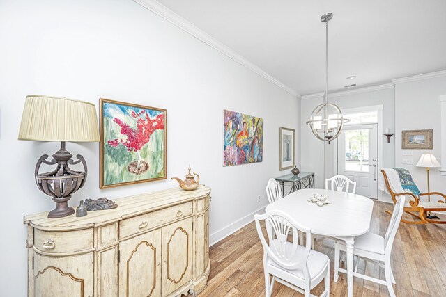 1515 Pogonia St Unit 2, Mount Pleasant, SC 29466 - dining space with a chandelier, light wood-style flooring, ornamental molding, and baseboards
