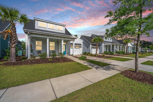 1515 Pogonia St Unit 2, Mount Pleasant, SC 29466 - view of front of property featuring a porch, driveway, a garage, and a yard