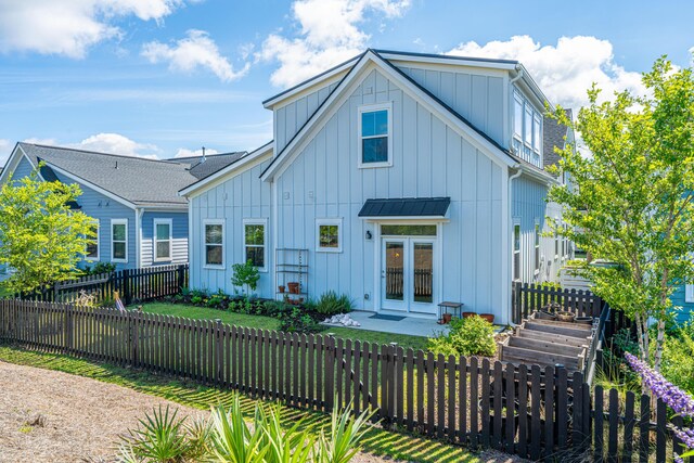 1515 Pogonia St Unit 2, Mount Pleasant, SC 29466 - rear view of property with board and batten siding, french doors, and a fenced backyard
