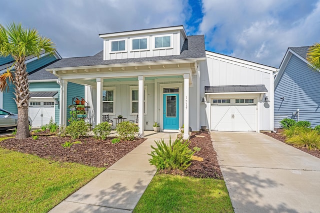 1515 Pogonia St Unit 2, Mount Pleasant, SC 29466 - view of front of property featuring board and batten siding, covered porch, an attached garage, concrete driveway, and a shingled roof