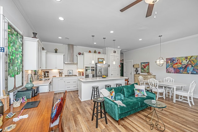 1515 Pogonia St Unit 2, Mount Pleasant, SC 29466 - living room with ornamental molding, ceiling fan, light wood-type flooring, and recessed lighting