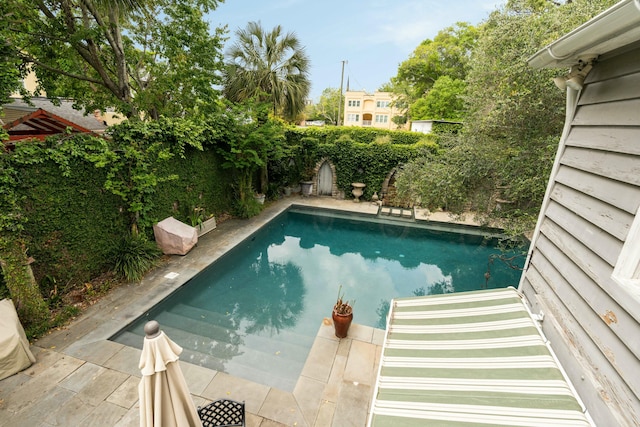 view of pool featuring a fenced in pool and a fenced backyard