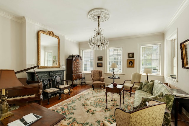 living area featuring a healthy amount of sunlight, crown molding, wood finished floors, and a notable chandelier