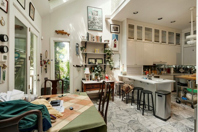 dining space with lofted ceiling