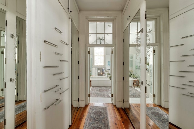 doorway to outside featuring wood-type flooring