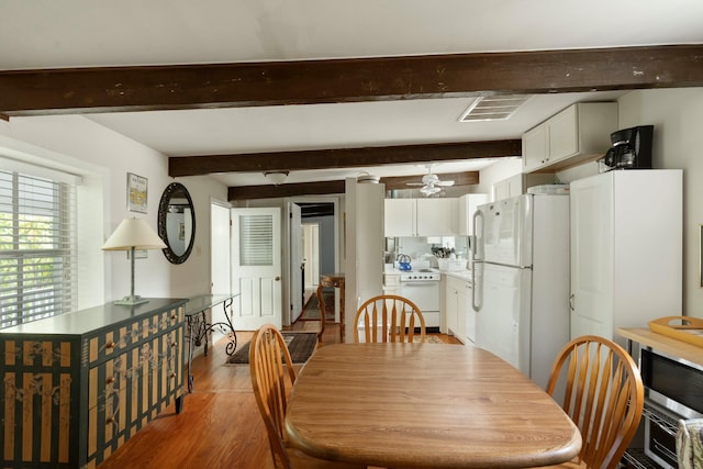 dining area featuring beamed ceiling, visible vents, ceiling fan, and light wood-style floors