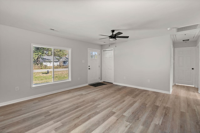 unfurnished living room with ceiling fan and light hardwood / wood-style flooring