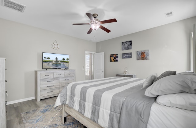 bedroom featuring ceiling fan and light hardwood / wood-style flooring