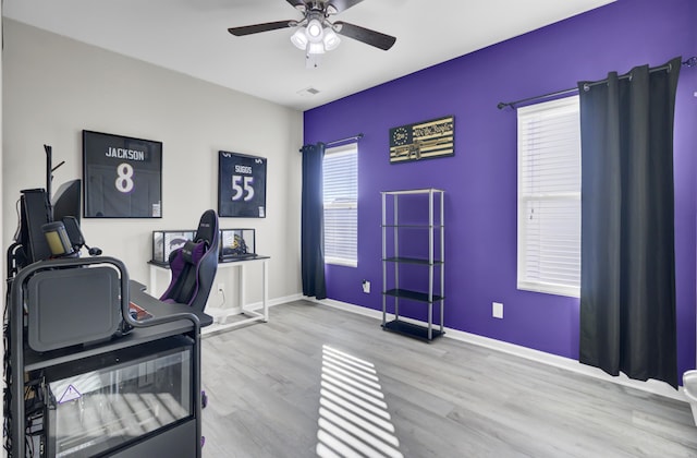 office featuring ceiling fan and light hardwood / wood-style flooring