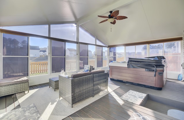 sunroom / solarium with vaulted ceiling with beams, a jacuzzi, and ceiling fan