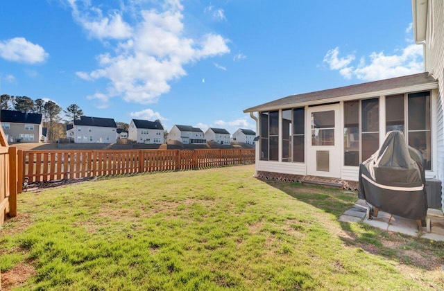 view of yard featuring a sunroom